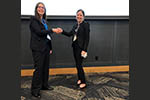 Melanie receivving 1st place poster award at Fall '22 AVS Prairie Chapter Symposium